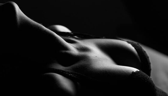 black and white photo of woman's chest