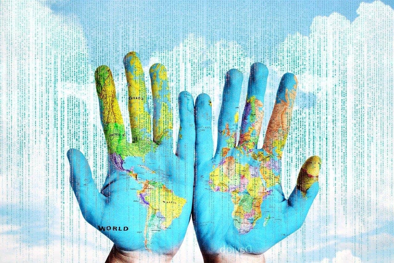 two hands colored as a world map