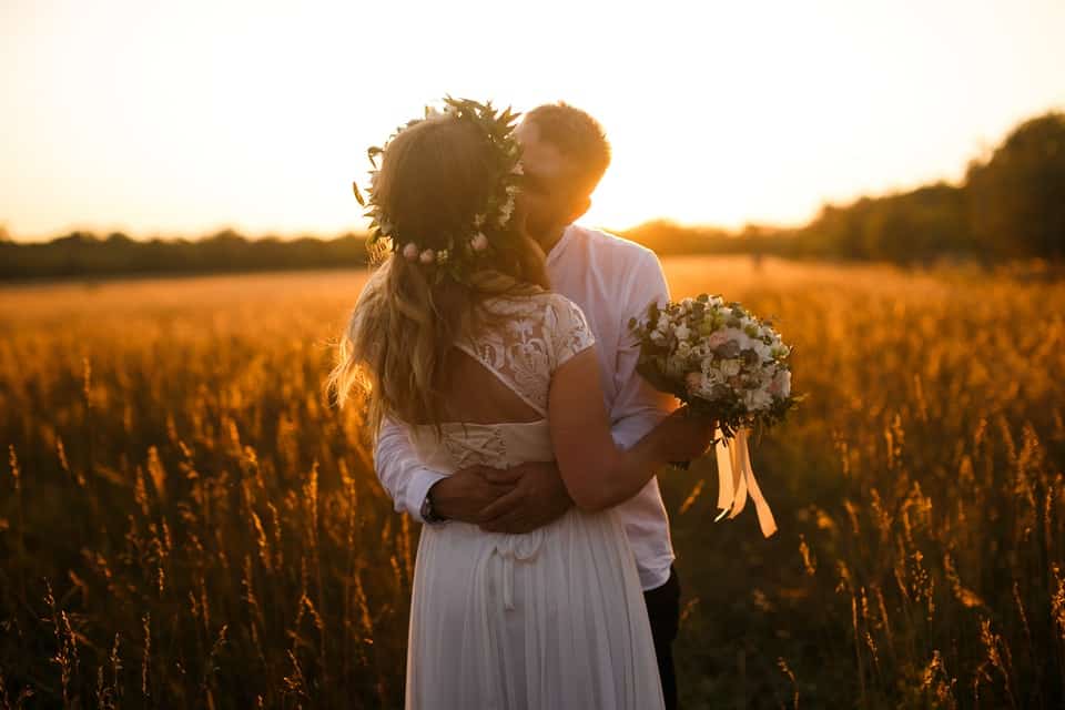 couple kissing in golden light