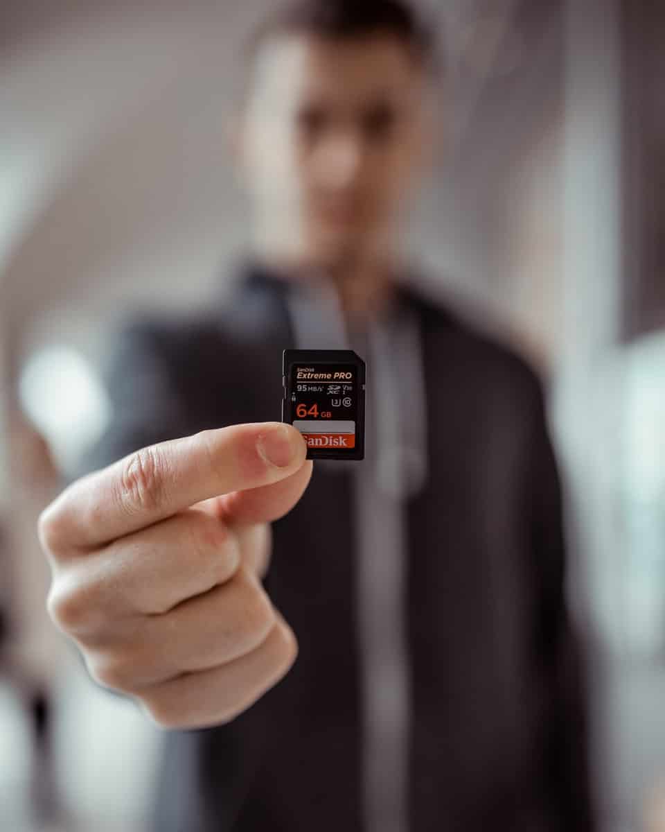 Person Holding SanDisk SD Card