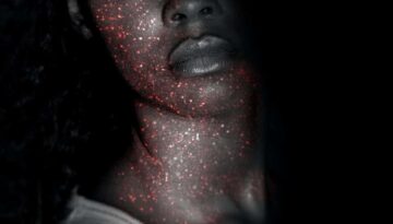 shadowed woman with glitter